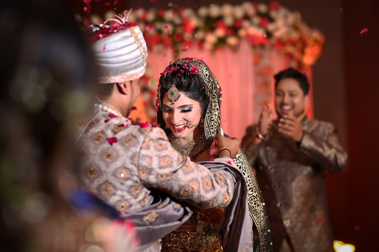 Joyful Indian couple sharing a heartfelt moment during their wedding ceremony.